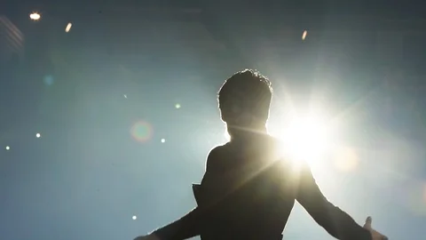 Silhouette of young man dancing in the spotlight on the night scene white light Stock Footage 118473017