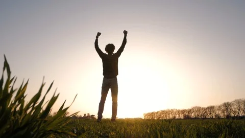 Silhouette of young man in fields Stock Footage 88414074
