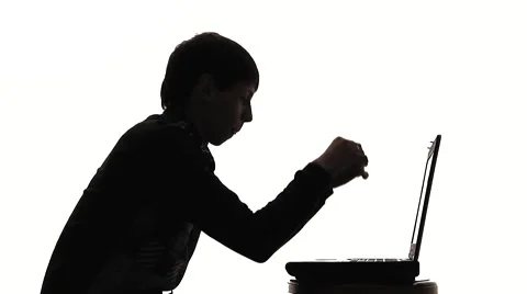 Silhouette Of Young Man Working At Laptop Video stock 59381816