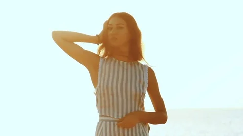 Silhouette of the young woman in backdrop of the sea Stock Footage