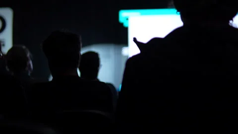 Silhouetted Audience Watching Presentation At Tech Startup Conference Stock Footage 338008128