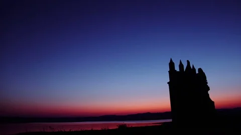 Silhouetted colonial Architecture on a setting sun background 動画素材 72523495