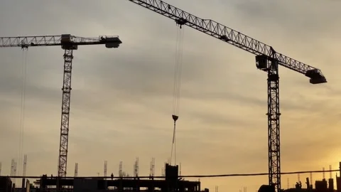 Silhouetted construction site at twilight Video stock 257598685