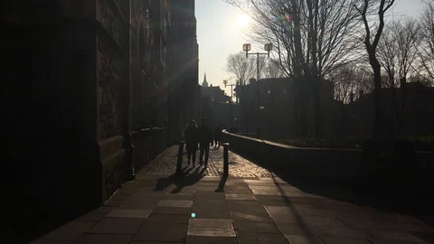 Silhouetted Couples Walking in the Sunset Outside Christ Church, Dublin 2018 Stock Footage 88558750