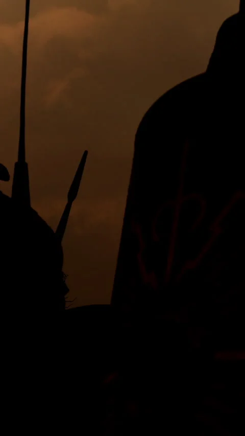 Silhouetted figures create a stunning contrast against a dramatic and Stock Footage 287491756