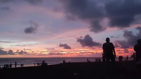 Silhouetted Figures at Sunset Beach Ocean, Sky, Dusk, People Stock Footage 292705517