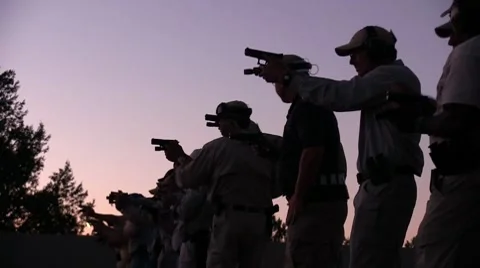 Silhouetted firearms (HD)c Stock Footage 8554228