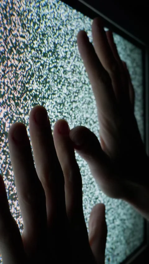 Silhouetted Hands Pressing Against Analog Television Screen Static Noise Stock Footage 335635515