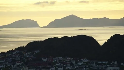 Silhouetted islands beyond Alesund rooftops, More og Romsdal, Norway Stock Footage 344536355