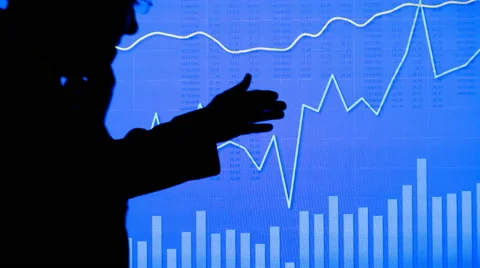 Silhouetted Man in Front of Blue Chart Stock Footage 68642937