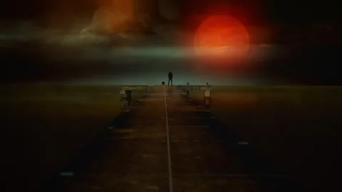 Silhouetted Man Ocean Pier Dramatic Fiery Sunset Scenery Видео 294549695