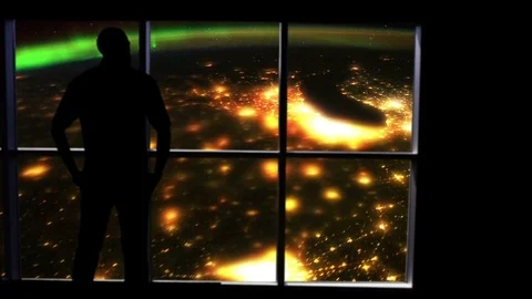Silhouetted man overlooking the Earth and aurora from space. Stock Footage 112890552