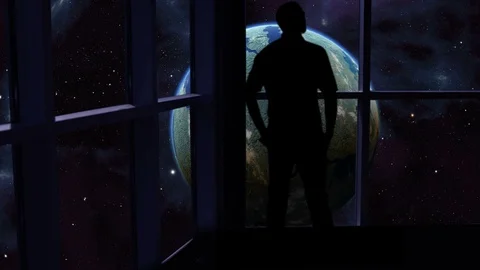 Silhouetted man overlooking the Earth from space. Stock Footage 112883732