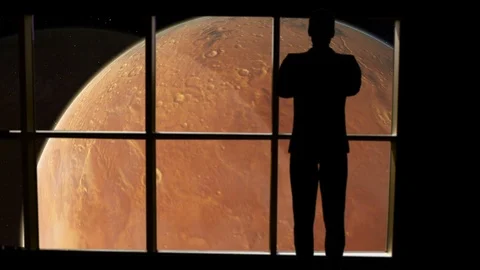 Silhouetted man overlooking Mars from space. Stock Footage 112890519