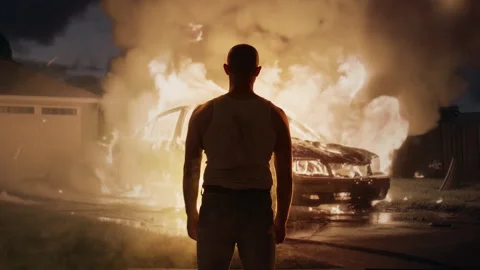 Silhouetted Man Watching Car Explosion Dark Night Dramatic Scene Cinematic Stock Footage 288874577