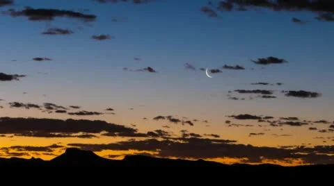 A silhouetted mountain range at dusk Stock Footage 54233169