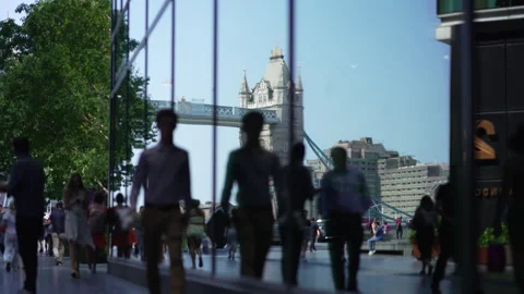 Silhouetted People Shake Hands In Front of Tower Bridge Reflection, 4K, 2024 Stock Footage 281579767
