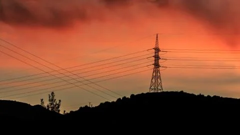 Silhouetted power stations Stock Photos