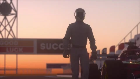Silhouetted Race Car Driver Standing Beside Formula Car at Sunset Stock Footage 323703951