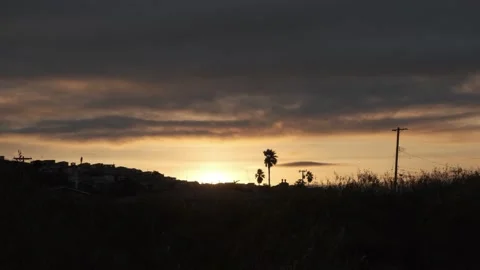 Silhouetted Road and Power Lines at Sunset - Morro Bay, California Stock Footage 345146478
