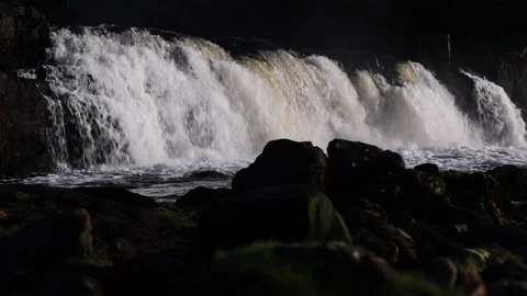 Silhouetted Rocks in Front of Aasleagh Falls, Erriff. Ireland. 4K60 Stock Footage 239400331