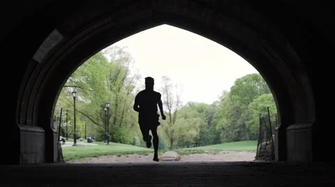 Silhouetted runner in 240 fps slow motion. Stock Footage 63435438