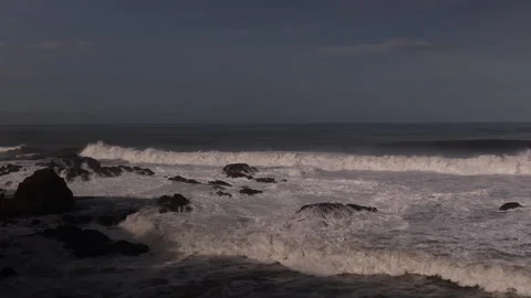 Silhouetted Sea Stacks with Breaking Waves. Jaco, Costa Rica. Stock Footage 243389312