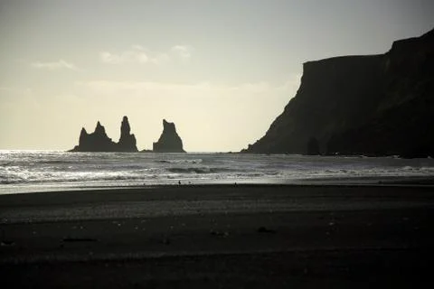 Silhouetted sea stacks Stock Photos