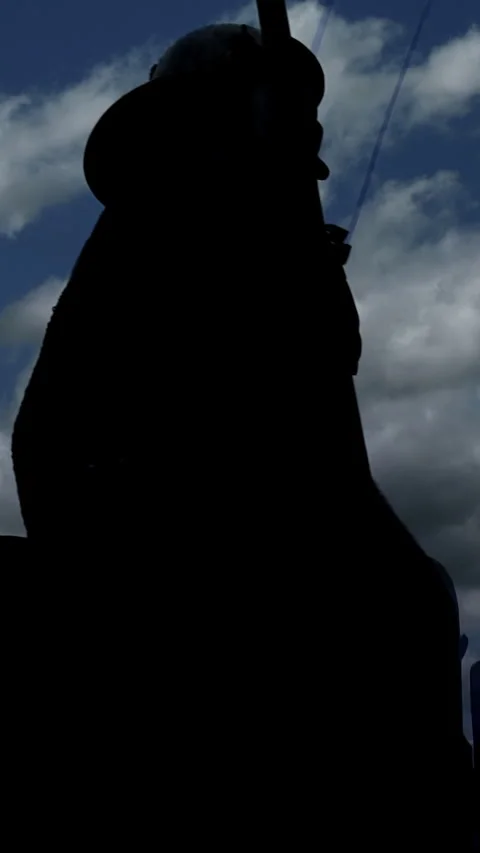 A Silhouetted Soldier Stands Against a Dramatic and Striking Sky That Stock Footage 287837119