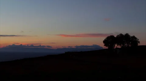 Silhouetted trees at sunset on Patmos 動画素材 68354214