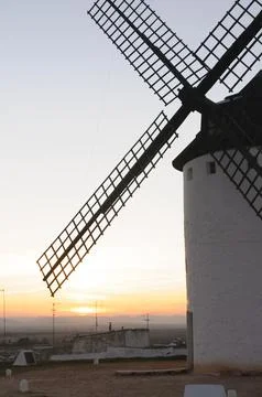 Silhouetted Windmill at Sunset Stock Photos