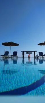 Silhouettes Admire View From Infinity Pool Stock Photos