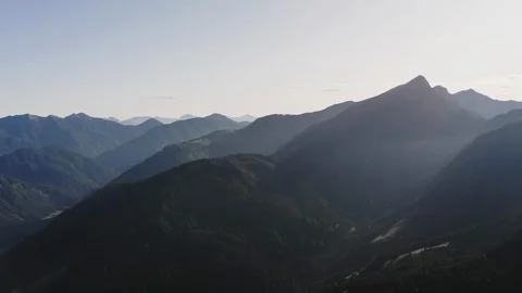 Silhouettes of alpine mountains at sunset Stock Footage 123273717