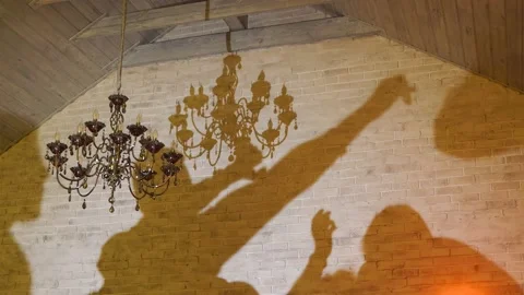 Silhouettes and shadows of people on the wall who are having fun 스톡 동영상 156633997