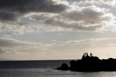 Silhouettes on the beach. Stock Photos