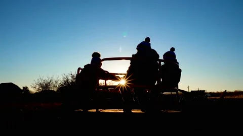 Silhouettes of children on the carousel 4K Stock Footage 99263138