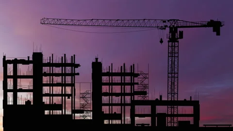 Silhouettes of construction cranes on the background of a sunset sky. Timelapse. Stock Footage 165727192