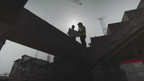Silhouettes of a Construction Site Workers Stock Footage 150890300