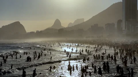 Silhouettes of Crowds Bathing at Leme Beach During Golden Sunset, Rio de Janeiro 스톡 동영상 327636809