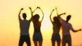 The silhouettes of dancing people on the sunrise background. slow motion 4k or 4k+ Resolution