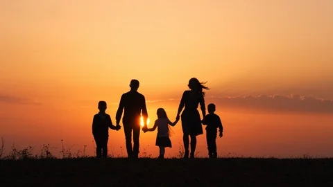 Silhouettes of happy family walking toge... | Stock Video | Pond5
