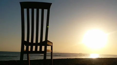 Silhouettes of light through a deck chair Stock Footage 52339376