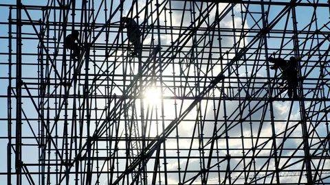 Silhouettes of male engineer worker at construction site. Workers at sunset Stock Footage 109149952