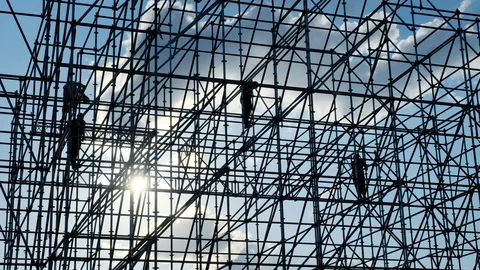Silhouettes of male engineer worker at construction site. Workers at sunset Stock Footage 109150069