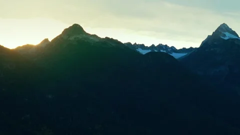 Silhouettes of mountains against the setting sun. Aerial view. Canada Stock Footage 289325295
