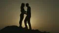 Silhouettes of newlyweds couple kissing passionately. Romantic love story HD Footage