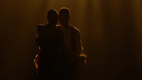 Silhouettes of a pair of dancers performing elements of Argentine dance appear Stock Footage 150583177