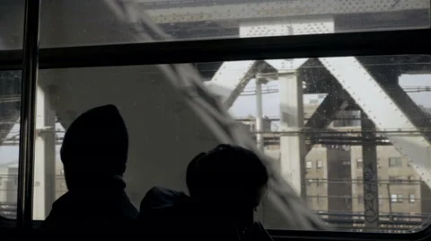 Silhouettes of passengers riding B train on elevated Brooklyn track with ghet 스톡 동영상 59862891
