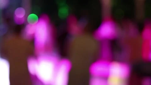 Silhouettes of people dancing at a night disco, no focus Stock Footage 345058439