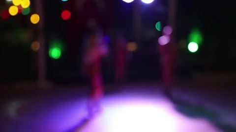 Silhouettes of people dancing at a night disco, no focus Stock Footage 345058440